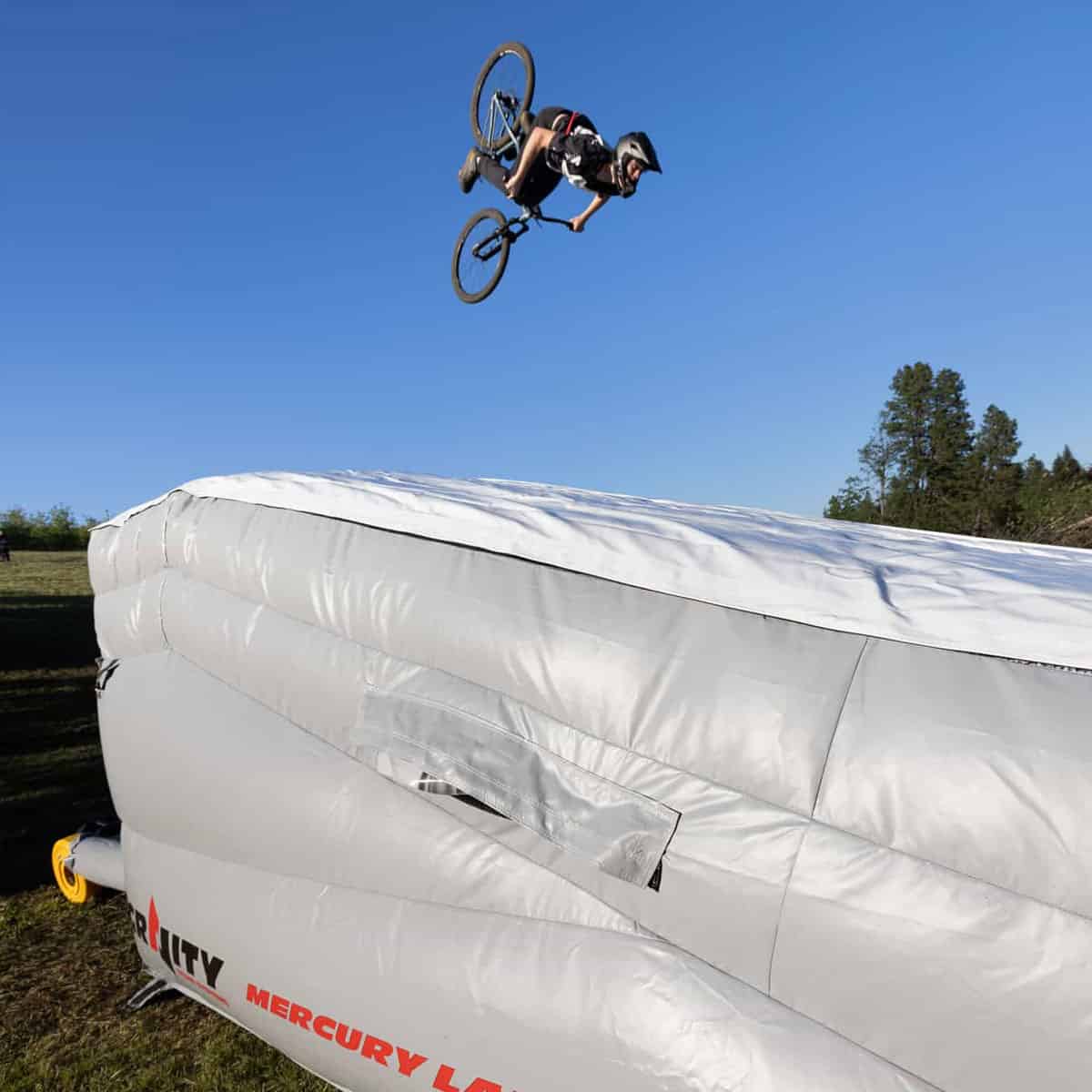 MTB bike catching air before landing on the pad