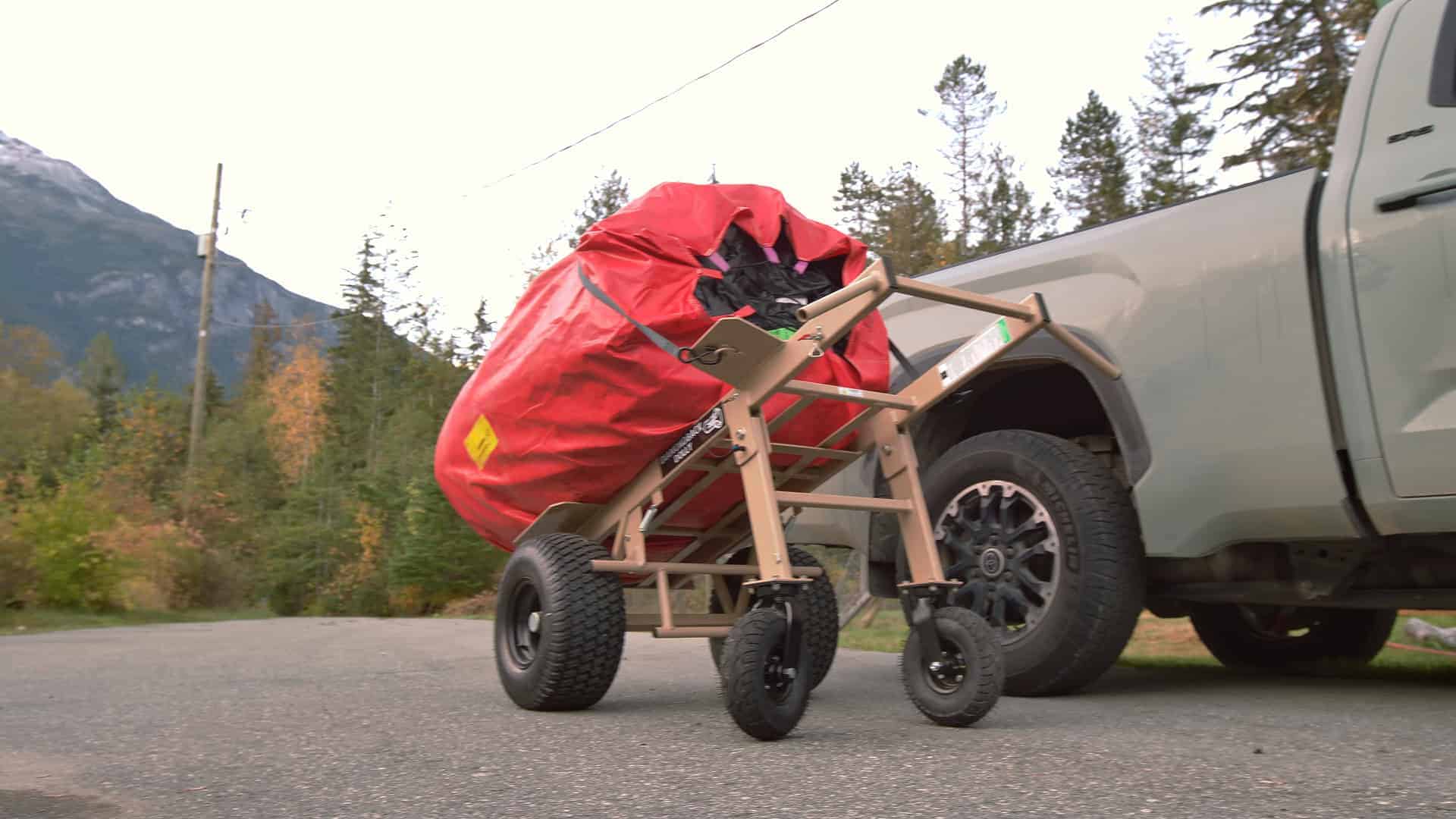 Photo of the landing pad in its transport bag on a wheelbarrow, ready to load into a pickup
