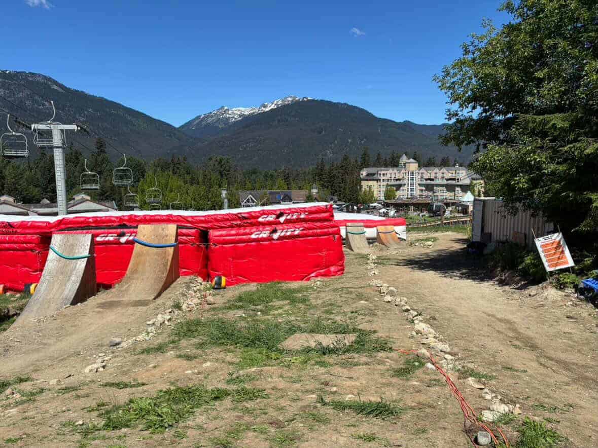An example of two DIY bike ramps in use at world-renowned outdoor sports destination, Whistler, B.C., in front of Gravity stunt pads