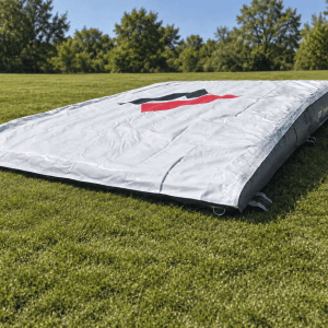 Sputnik Lander kids crash mat set up on grass with its low ride-off edge visible.